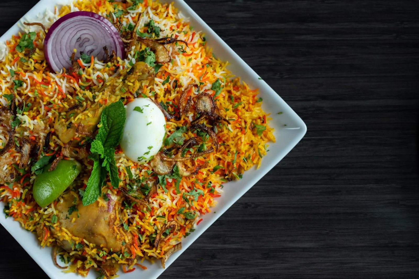 Chicken Biryani with basmati rice, egg and fried onions