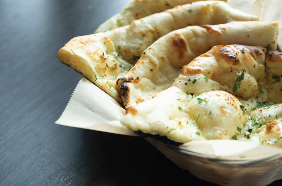 Basket of fresh garlic naan
